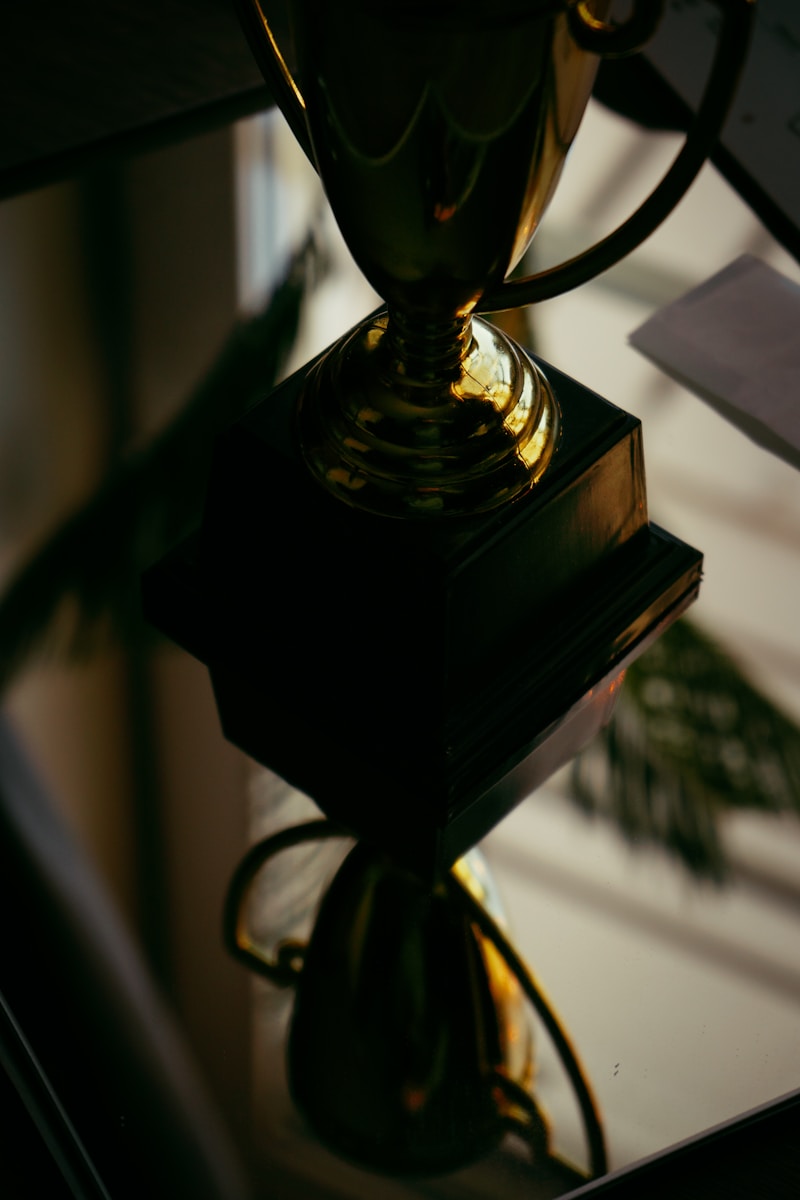 a glass trophy sitting on top of a table